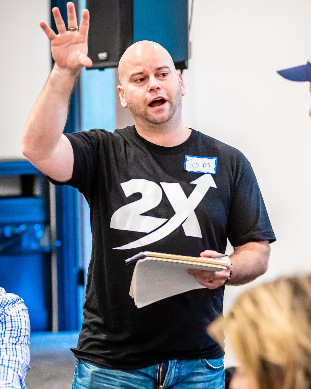 Tom Sylvester teaching business strategy at a 2X event